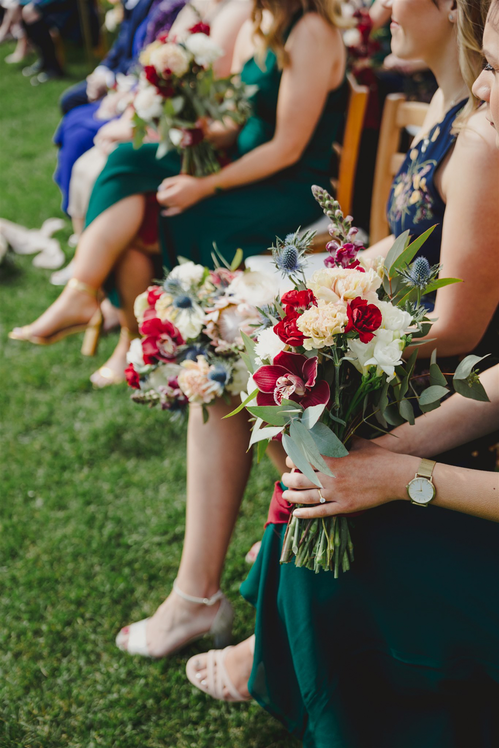 close up of bridesmaids dresses and bouquets