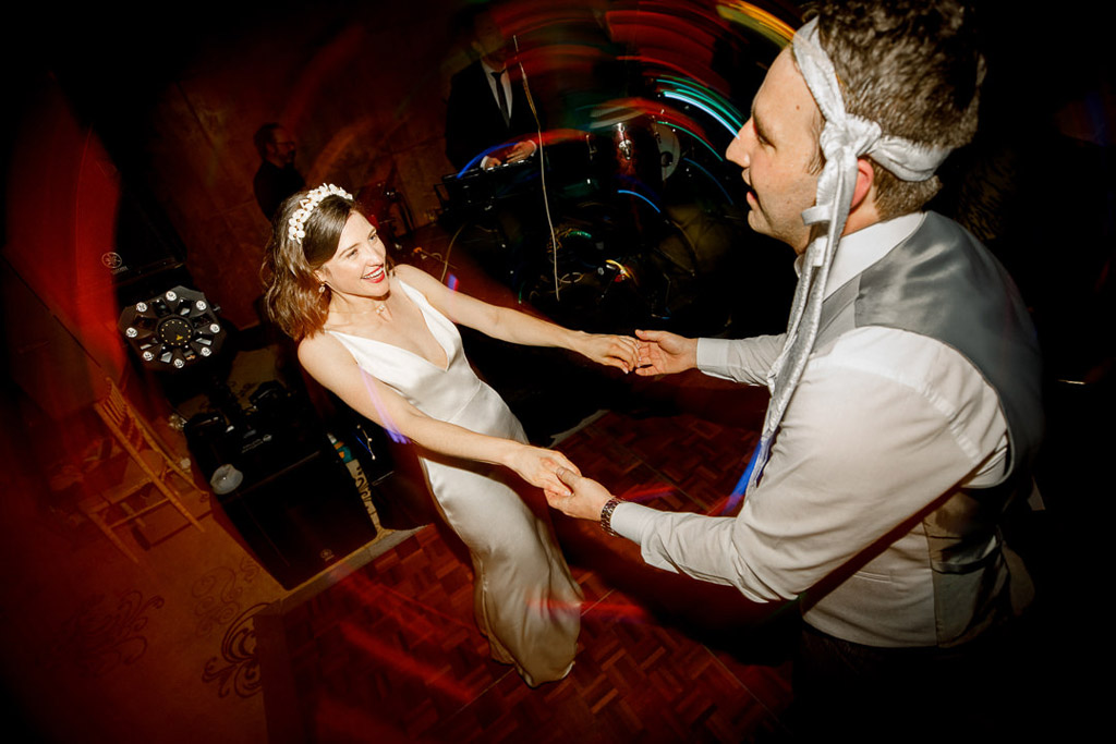 bride and groom dance on the dancefloor together